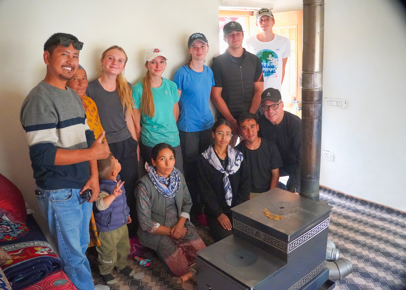 Students after installing the rocketstove for the household Students after installing the rocketstove for the household