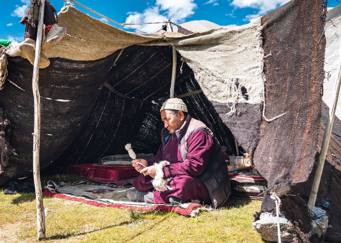 An artisan spinning Pashmina wool