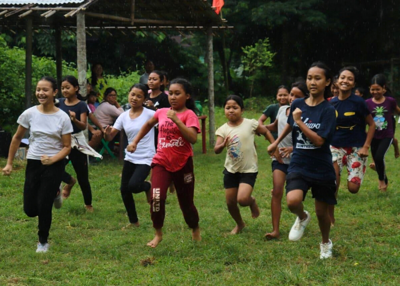 Young girls competing with energy and determination at a community sports meet