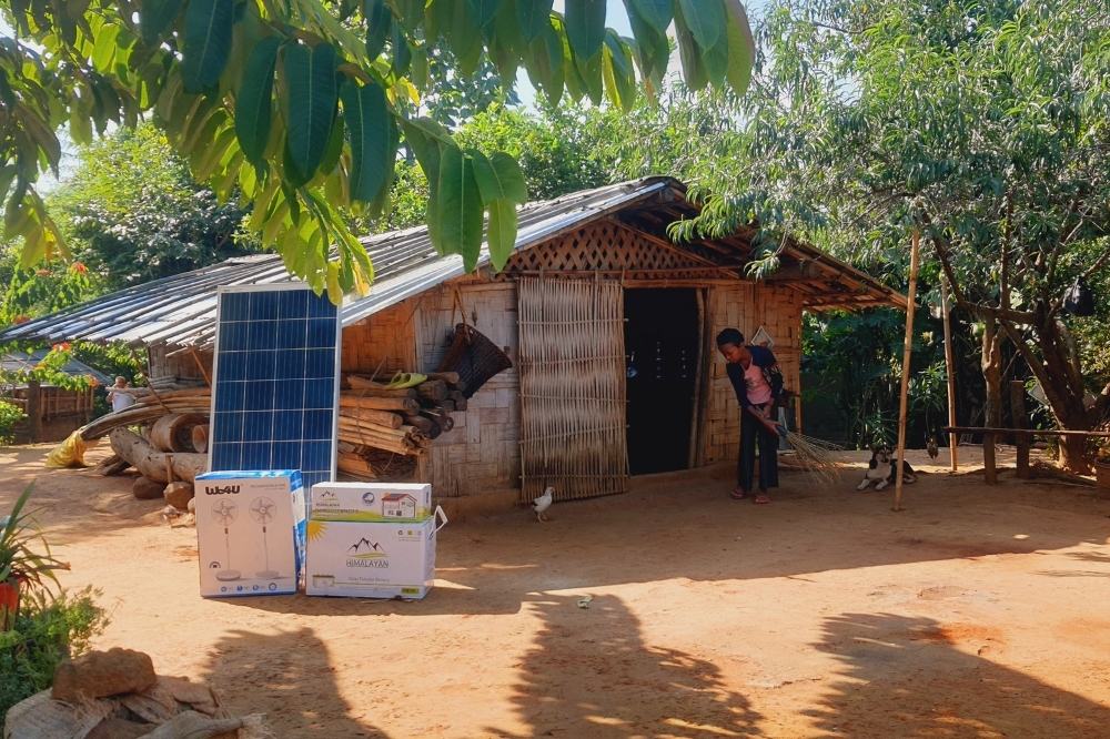 A rural household powered by a solar energy system, showcasing how clean energy access supports daily life and strengthens community resilience in remote villages